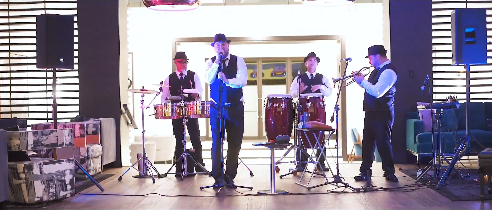 a four-man band performing live music inside of Isolé Villas. Reunion Resort. Orlando, Florida.